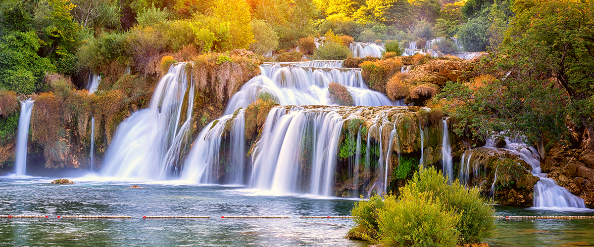 Amazing nature landscape, beautiful waterfall at sunrise, famous